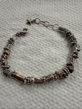 Beautiful Jes Maharry Labor of Love bracelet in gold and silver beads.